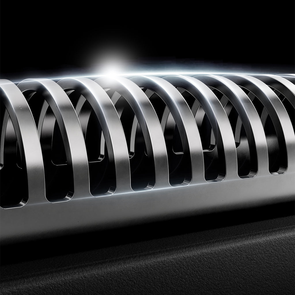 Close-up of a metal spring on a black background